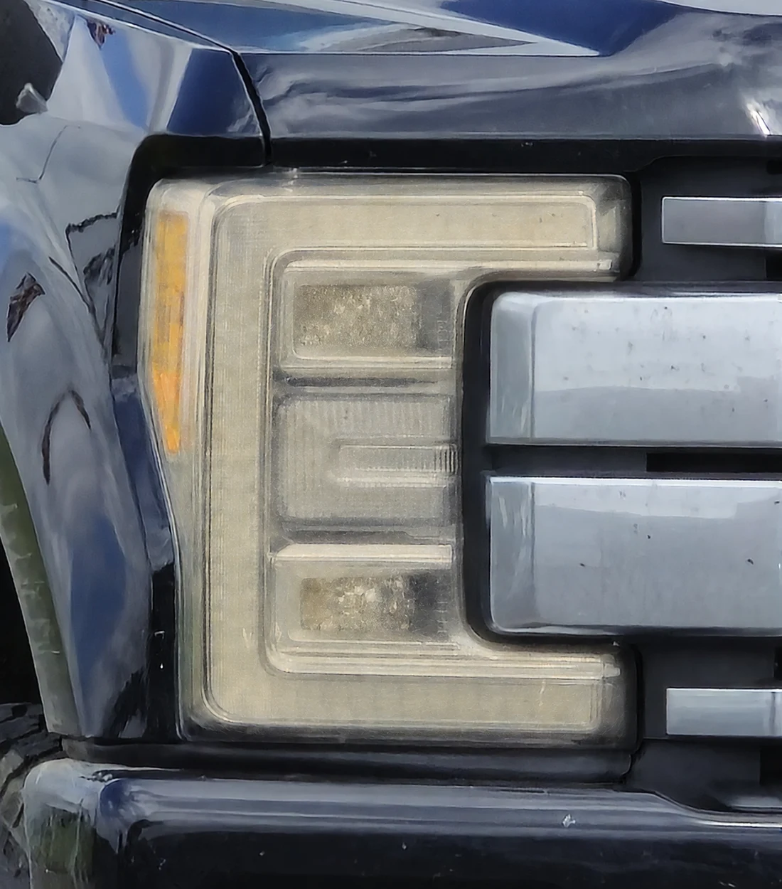 The same ford f-350 / super duty headlight with oxidation — generated illustration